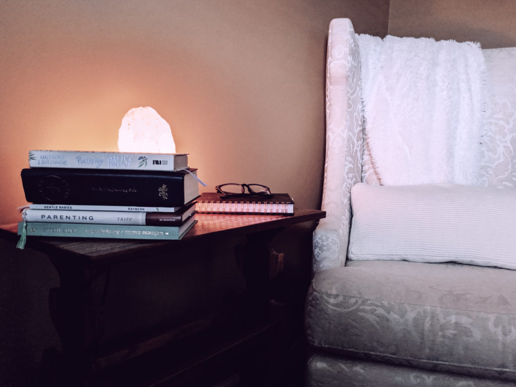 cozy nook with plush blanket, books and himalayan salt lamp